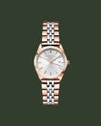 Two-tone watch with rose gold and silver bracelet on a white background