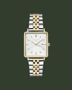 Two-tone watch with silver and gold band on a white background
