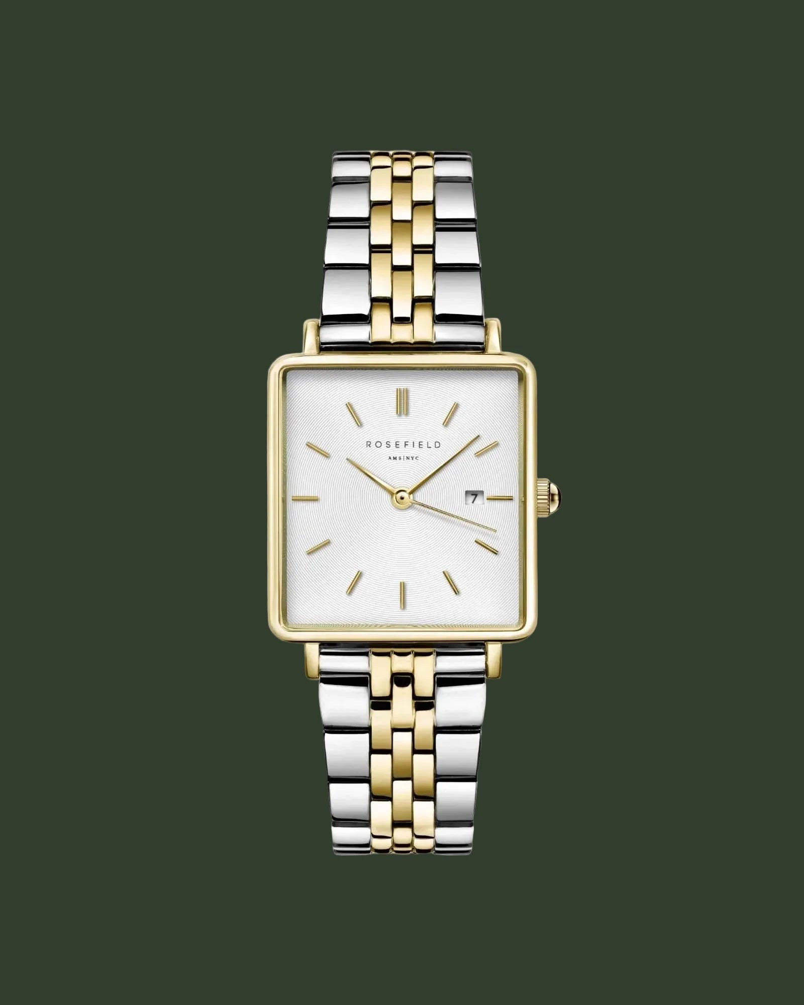 Two-tone watch with silver and gold band on a white background