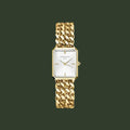 Gold chain-link watch on a white background