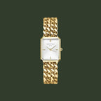 Gold chain-link watch on a white background