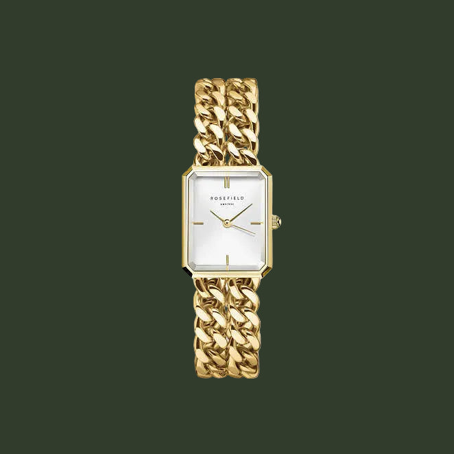 Gold chain-link watch on a white background
