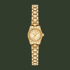 A gold-tone Michael Kors analog watch with a matching metal link bracelet, featuring a gold dial with crystal hour markers and a crystal-encrusted bezel, shown against a plain white background.