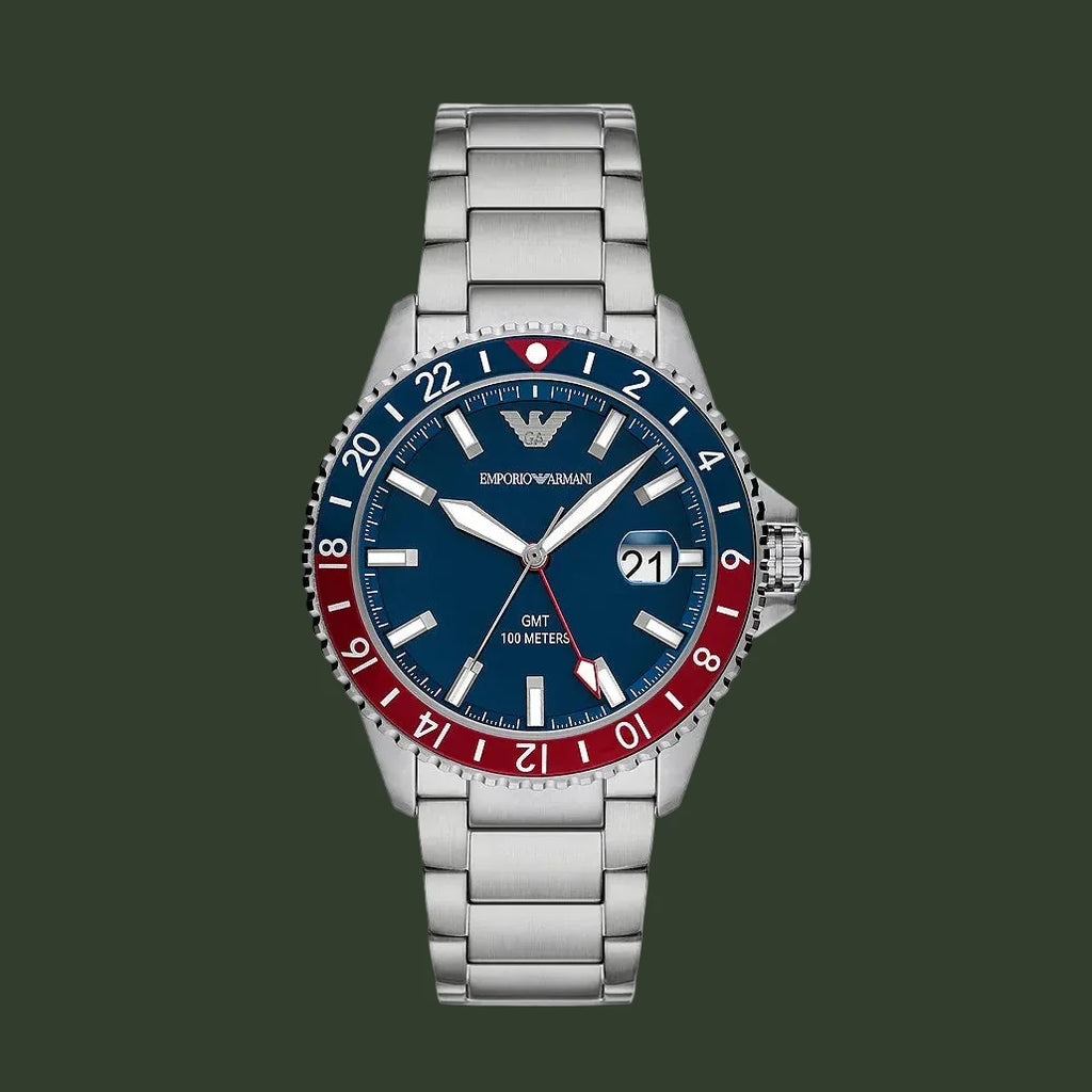 Silver watch with a blue and red face on a white background