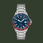 Silver watch with a blue and red face on a white background