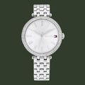 Silver watch with gemstone accents on a white background