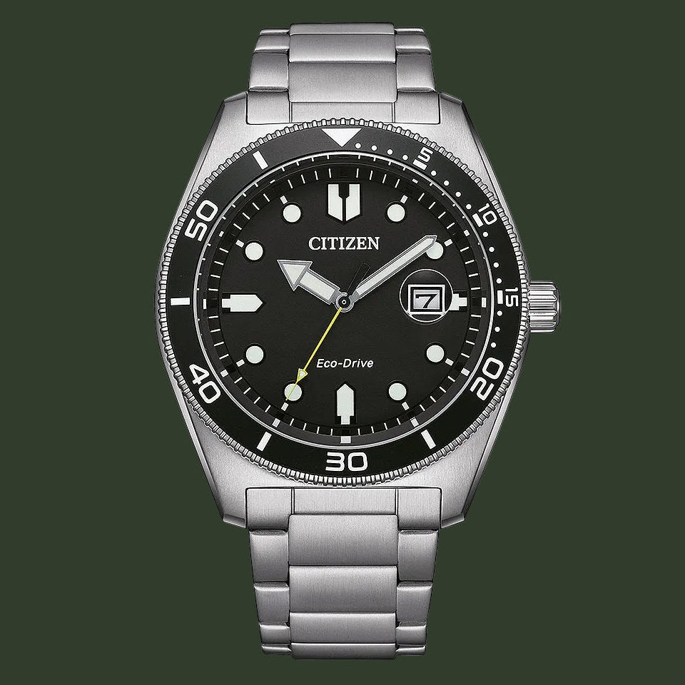 Citizen Eco-Drive stainless steel watch with a black dial, black rotating bezel, silver-tone case, and integrated link bracelet on a white background.