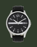 Black Armani Exchange watch on a white background