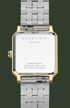 Rosefield women's watch with a silver stainless steel link bracelet and a gold-tone case, showing the back of the watch with engraved text on a white background.