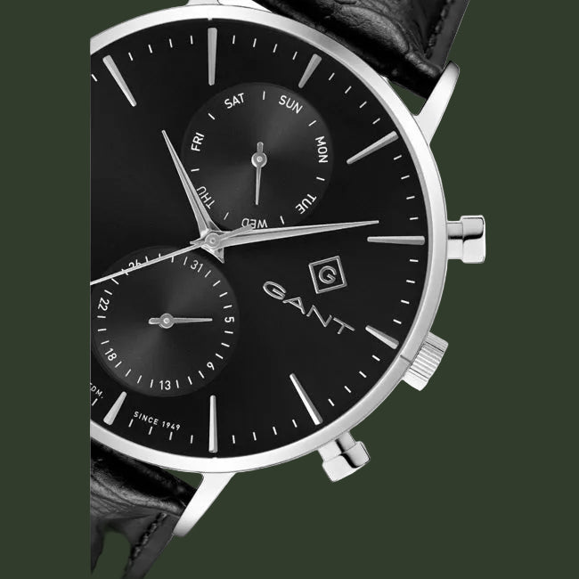 A GANT men's analog watch with a black dial, silver-tone case, and black leather strap, shown on a plain white background.