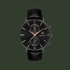 Black watch with rose gold accents on a white background