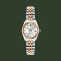 Two-tone watch with silver and gold bracelet on a white background