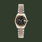 Gold wristwatch with a brown dial on a white background