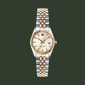 Two-tone watch with a gold and silver bracelet on a white background