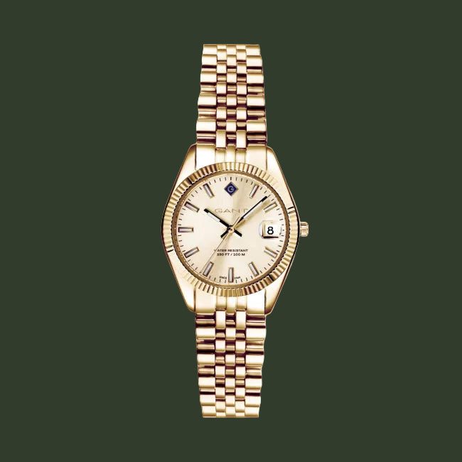 A GANT men's watch featuring a gold-tone metal bracelet, a fluted bezel, and a cream-colored dial with a date window.