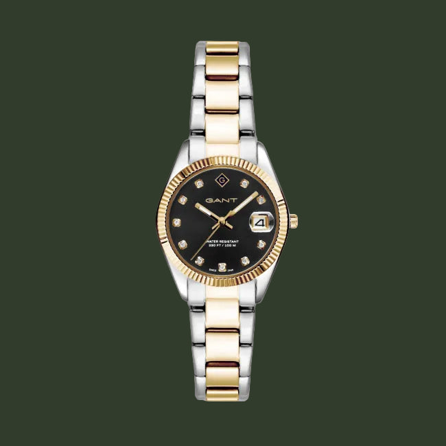 Two-tone watch with black dial and gold accents on a white background