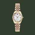 A GANT watch with a gold-tone metal bracelet and case, featuring a white dial with gold-tone hands and markers, on a plain white background.
