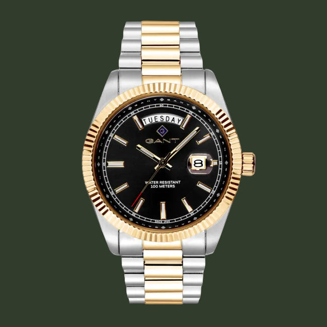 A GANT men's watch featuring a two-tone silver and gold stainless steel link bracelet, a fluted gold-tone bezel, and a black dial with gold hands and markers.