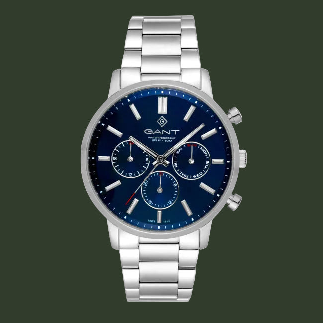 A GANT men's stainless steel chronograph watch with a deep blue dial and matching blue sub-dials, featuring silver-tone metal case and link bracelet on a white background.