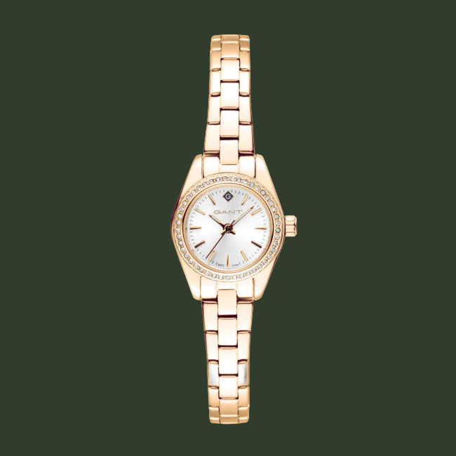 A women's rose gold watch with a matching metal link bracelet, featuring a white dial with small diamond hour markers and a bezel accented with clear crystals, shown against a plain white background.