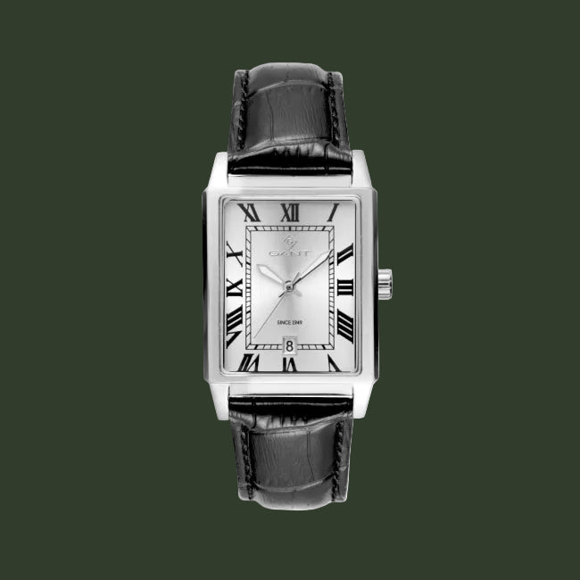 A Cartier wristwatch with a rectangular silver-tone case, a white dial with black Roman numerals, and a black alligator-textured leather strap, shown against a plain white background.