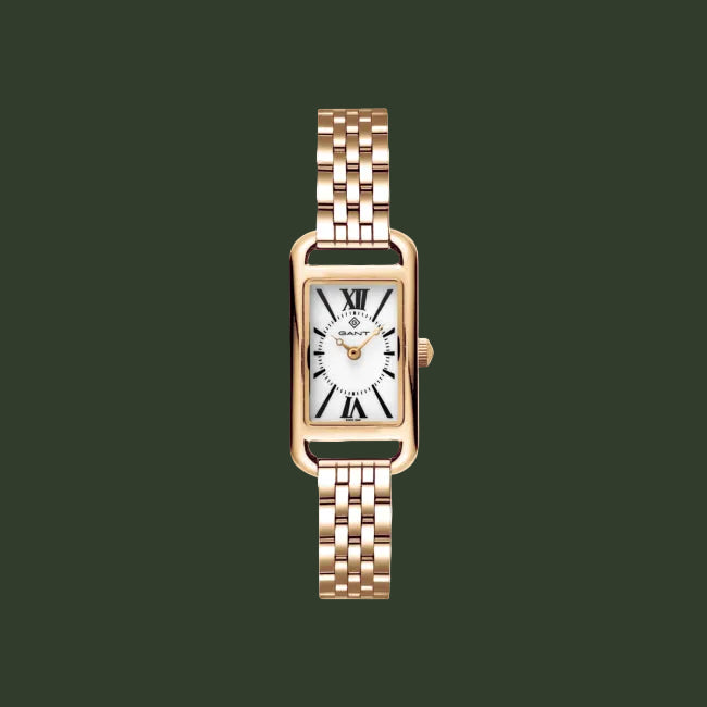 A women's rectangular quartz watch with a rose gold-tone metal case and link bracelet, featuring a white dial with black Roman numerals and gold hands.