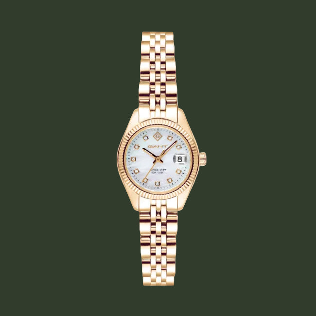 A women's wristwatch with a rose gold metal case and link bracelet, featuring a white dial with crystal hour markers and a date window at the 3 o'clock position.