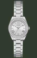A silver-tone stainless steel wrist watch with a link bracelet, a crystal-studded bezel, and a white dial with Roman numerals. The brand name 'GUESS' is visible on the dial.