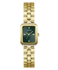 A gold-tone women's wristwatch with a rectangular green dial, gold-tone bezel accented with small clear crystals, and a matching gold-tone link bracelet. The brand name 'GUESS' is clearly visible on the dial.