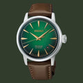 A Seiko Presage Automatic watch featuring a green dial, gold-tone hands and hour markers, and a brown leather strap, shown against a plain white background.