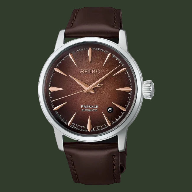 A Seiko Presage Automatic watch with a brown leather strap, a brown dial, and rose gold-tone hands and hour markers, set against a plain white background.
