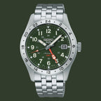 A Seiko Automatic GMT watch with a silver stainless steel link bracelet, a green dial, and a silver rotating bezel, shown on a plain white background.