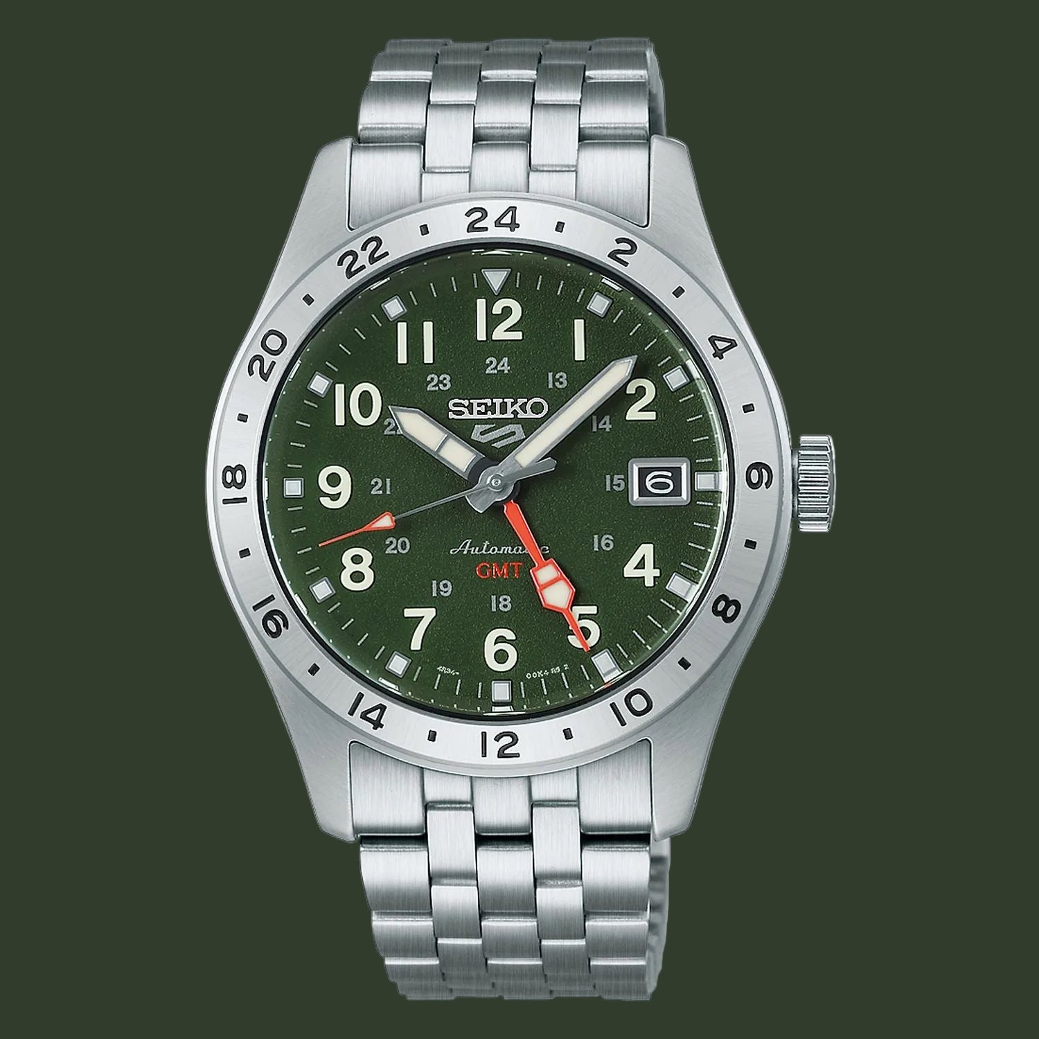 A Seiko Automatic GMT watch with a silver stainless steel link bracelet, a green dial, and a silver rotating bezel, shown on a plain white background.