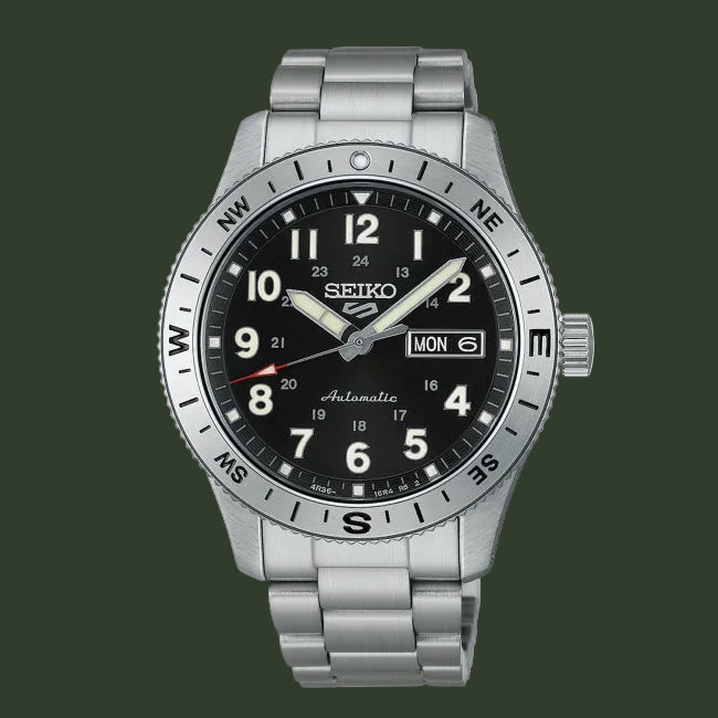 A Seiko automatic wristwatch with a silver stainless steel case and link bracelet, featuring a black dial with white Arabic numerals and a rotating bezel.
