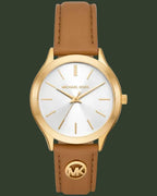 Michael Kors watch with gold case and brown leather strap on a white background