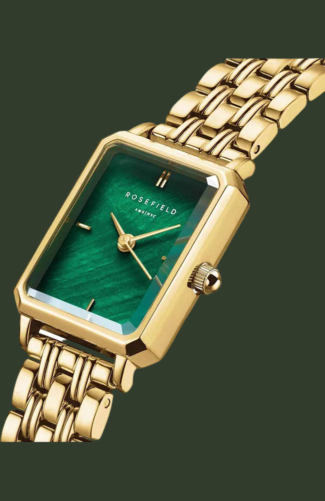 Rosefield wristwatch with a gold-tone metal case and link bracelet, featuring a green dial with gold hands and indices.