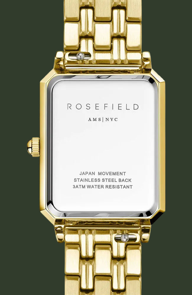 Rosefield Ams|Nyc stainless steel watch with a gold-tone metal link bracelet and bezel, featuring a white dial on the back cover.