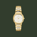 Gold watch with a white face on a light beige background