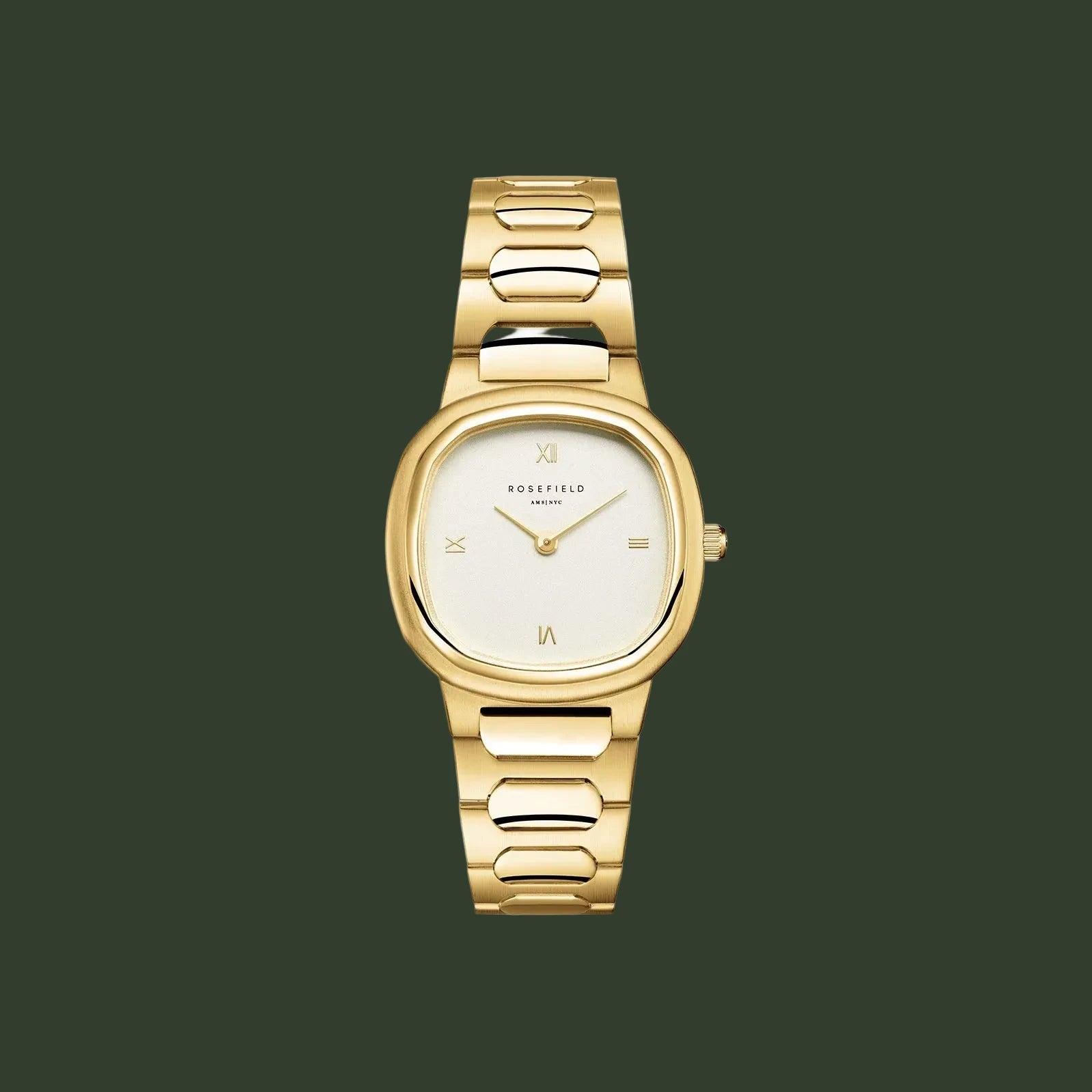 Gold watch with a white face on a light beige background