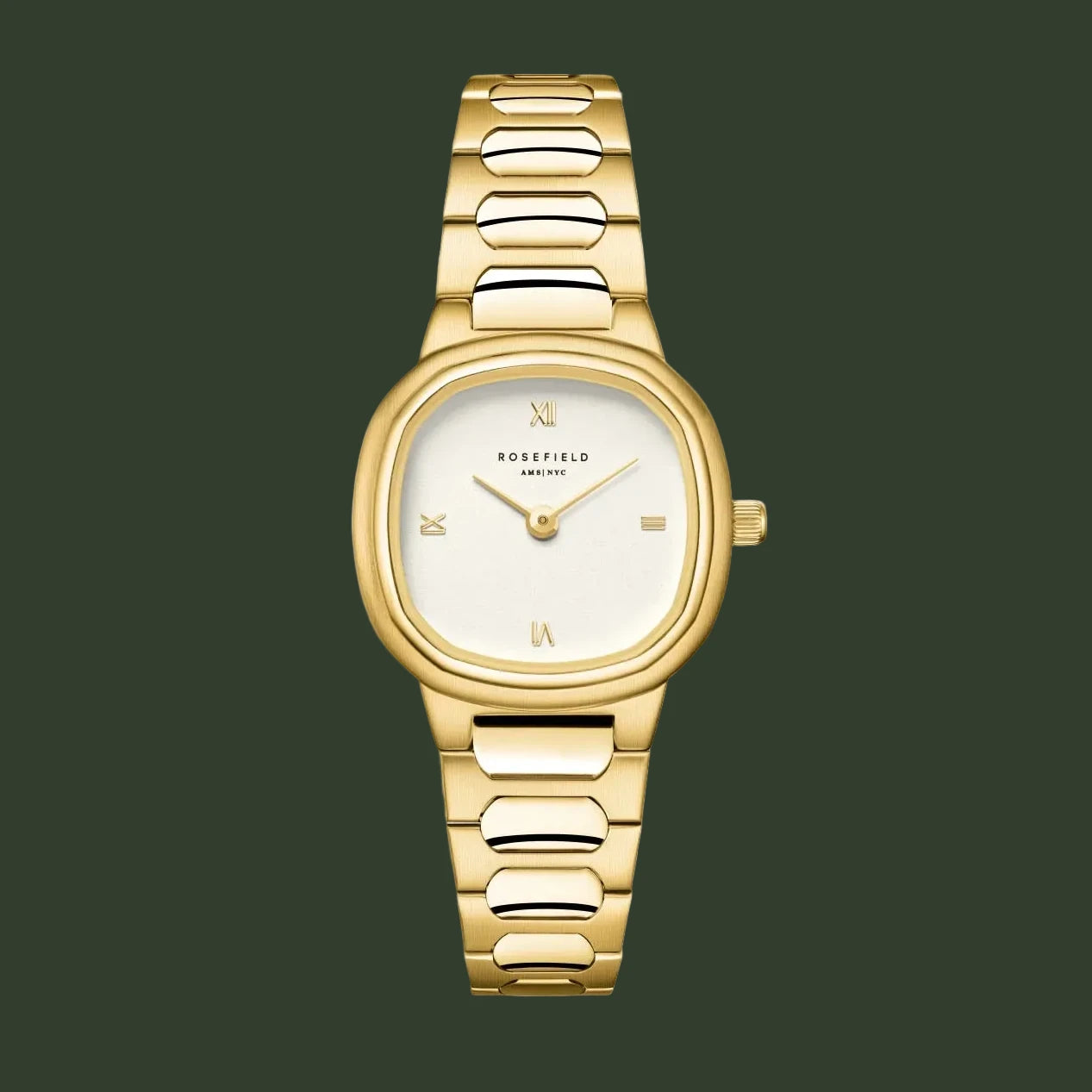 Gold watch with a white face on a light beige background