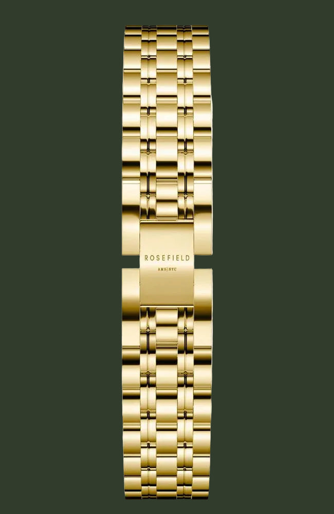 A gold-tone stainless steel link watch band with a polished finish, featuring the 'ROSEFIELD' brand name engraved on the center clasp, shown against a light off-white background.