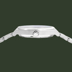 Close-up side view of a silver stainless steel watch with a matching metal link bracelet, featuring a prominent crown button on the side.