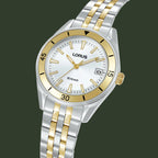 A LORUS women's two-tone stainless steel and gold watch with a white dial, featuring a silver and gold link bracelet, a gold bezel, and a date window.