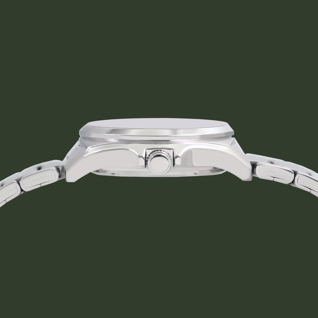 Close-up side view of a stainless steel wristwatch with a matching metal link band, shown against a plain white background.
