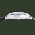 Close-up of a silver watch with a black strap on a white background