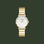 Gold watch with a white face on a light gray background