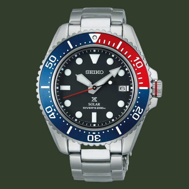 Seiko watch with a red and blue bezel on a white background