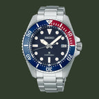 Seiko watch with blue and red bezel on a white background
