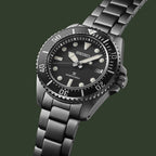 Seiko watch with black dial and silver metal bracelet on a white background