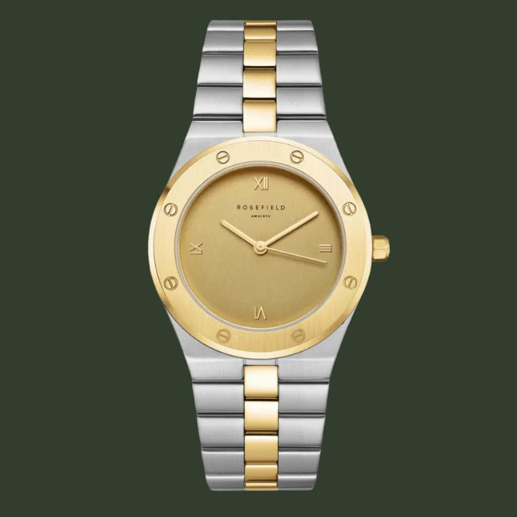Two-tone watch with gold and silver band on a light gray background